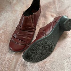 Rieker slip in ankle boots with 1” heel in a deep red/burgundy